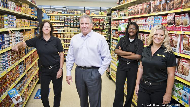 Dollar General Ceo Todd Vasos Center With Companyociates Left To Right Dollar General Ceo Todd Vasos Center With Companyociates Left To Right