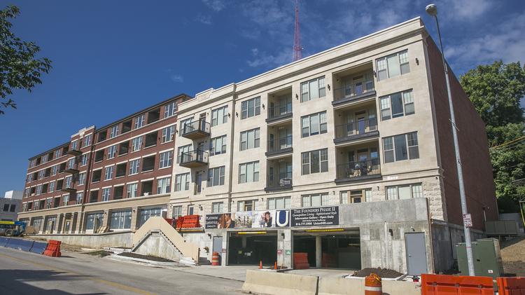 The 56-unit McCoy Building at 3020 Gillham Road (left) and 23-unit Campbell Building at 3000 Gillham Road (right) — will both be completed by around October.