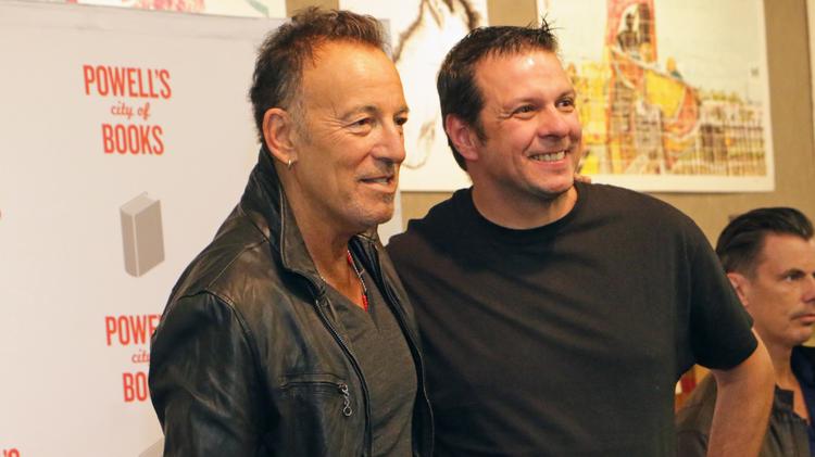 Bruce Springsteen and a fan during an appearance at Powells Books in Portland, Oregon.