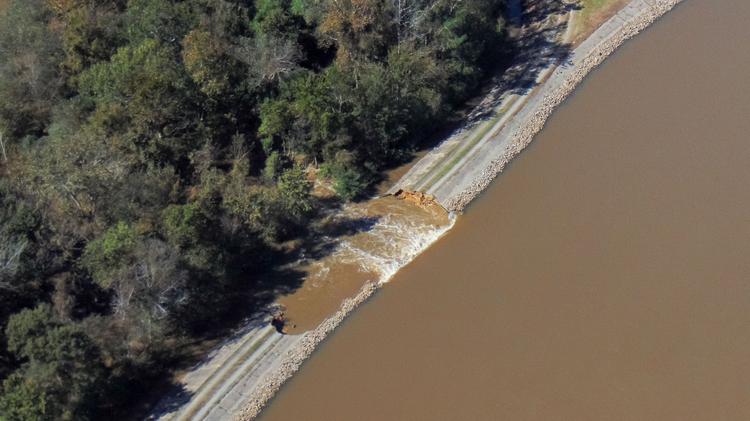 The WaterKeeper Alliance says a picture taken Tuesday clearly shows the H.F. Lee dam breach. Duke had said a helicopter inspection Wednesday morning determined the dam was intact at that time.