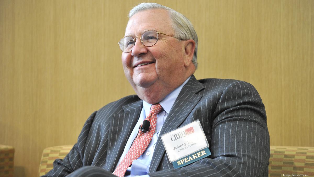 Johnny Harris, president of Charlotte's Quail Hollow Club, embraces