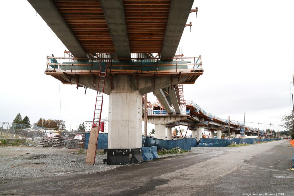 This is a view of Sound Transit light rail construction underway in Kent. A report finds one-third of the land near transit hubs in the Puget Sound area is zoned for single-family housing.