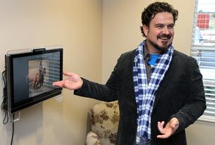 Jason Wiley, chief creative officer of The Oxford Grand, explains the uses of the SimpleC Companion system inside a memory care unit Friday morning at The Oxford Grand, 3051 North Parkdale Circle.