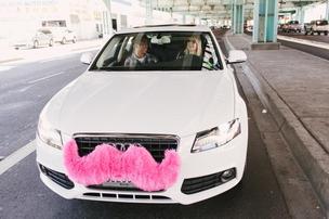 Lyft drivers adorn their vehicles with pink mustaches.