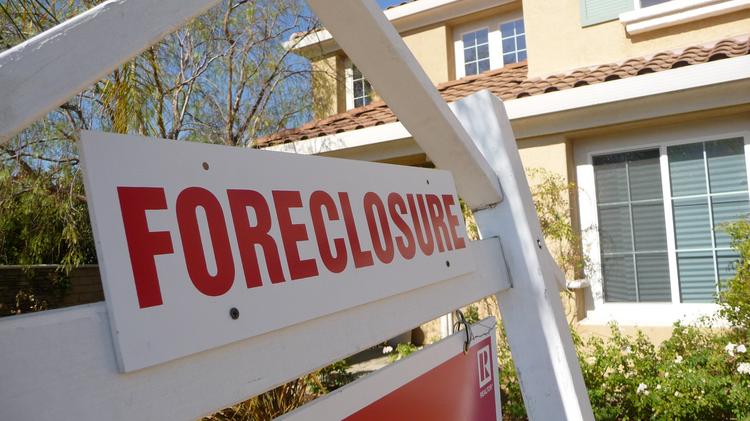 Housing foreclosure rates in the Los Angeles area stayed flat in January compared with December but foreclosure inventory fell sharply compared with a year ago.