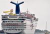 Carnival lowers earnings forecast after Triumph disaster