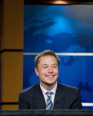 Why this guy's so happy: Tesla Motors CEO Elon Musk just paid off his government loans, some $541.8 million.