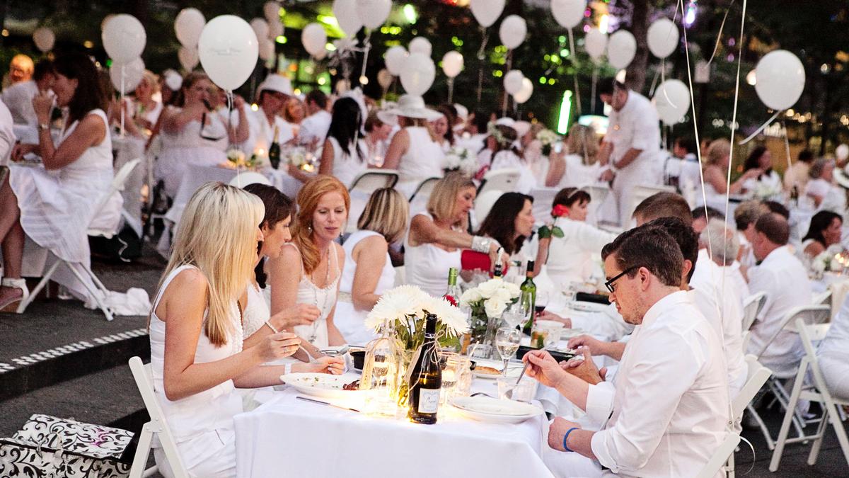 Scenes from the Dîner en Blanc party on Cincinnati's Fountain Square