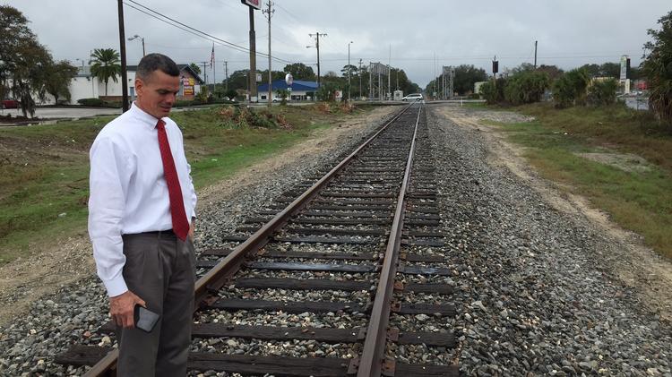 Mark Sharpe, shown here by the railroad tracks near the corner of Fowler and Nebraska avenues, has taken the leadership role in the Tampa Innovation Alliance, which holds its kickoff event Friday on the USF campus.