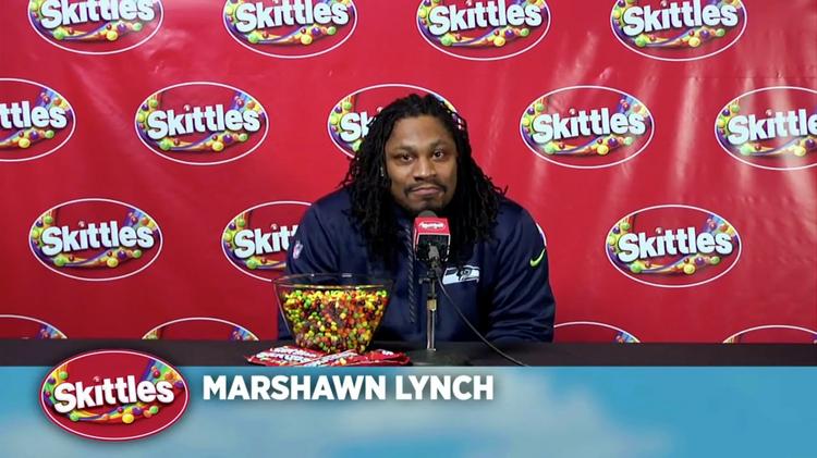 Marshawn Lynch of the Seattle Seahawks eats Skittles as he addresses  News Photo - Getty Images