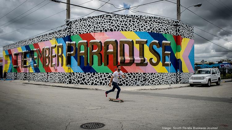 A skateboarder makes his way along NW 3rd Avenue in Miami's Wynwood Art District.