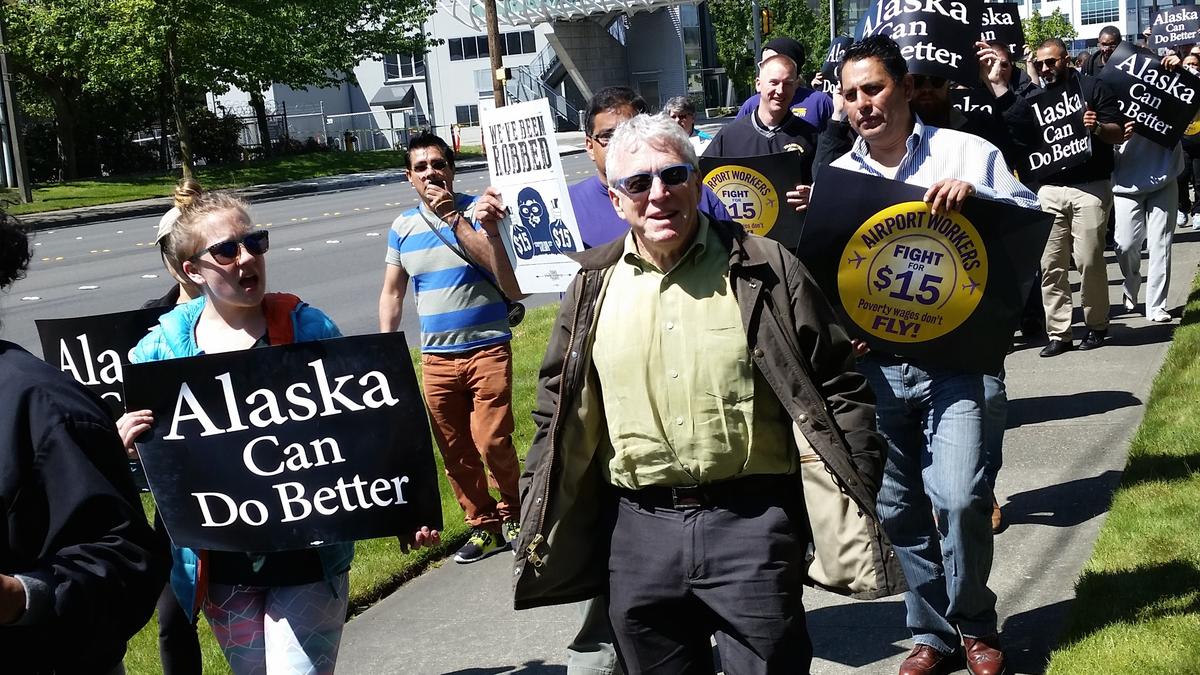 Protesters at Alaska Air annual meeting demand pay raise for baggage