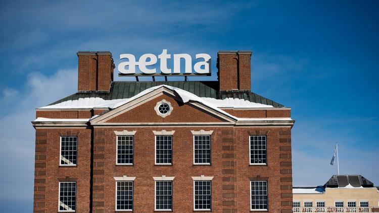 Snow covers the roof of Aetna Inc. corporate headquarters in Hartford, Conn., in this file photo.