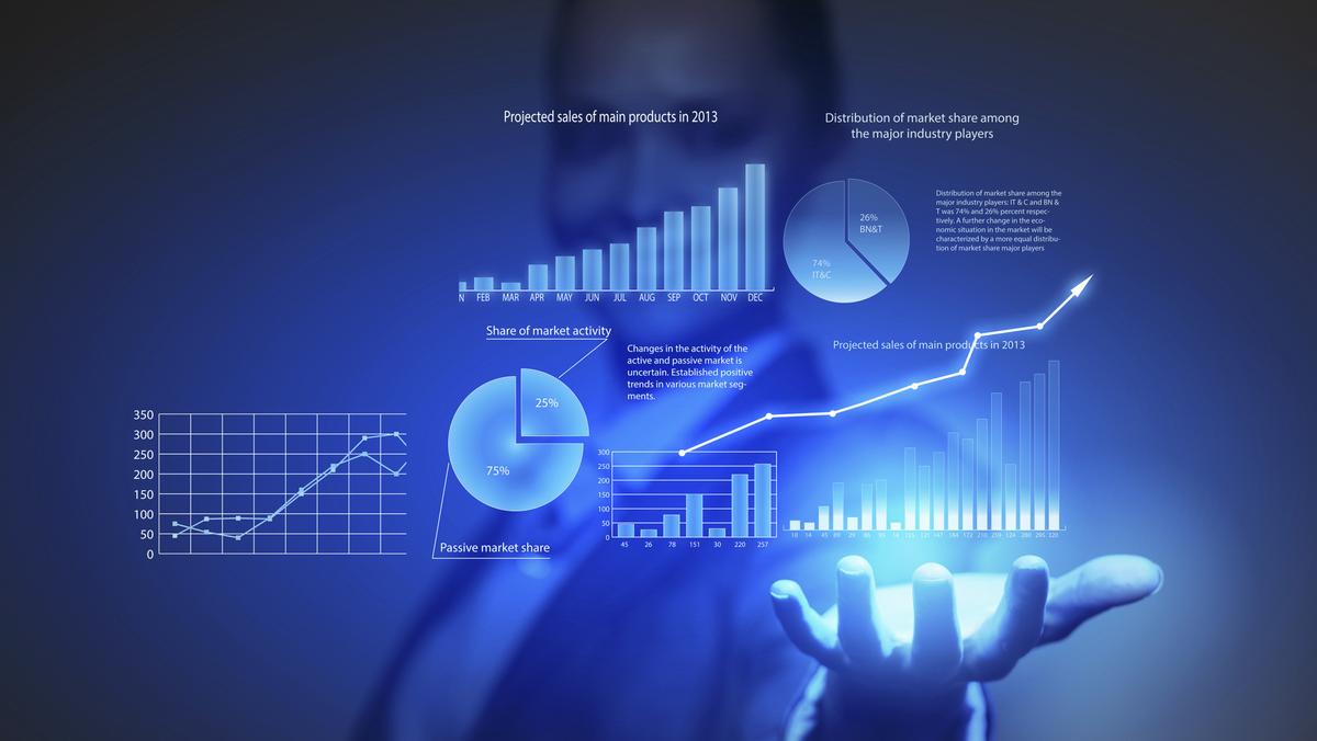  A businessman in a suit holding a glowing blue orb with data charts and graphs representing the search query 'Datadriven marketing performance analysis'.