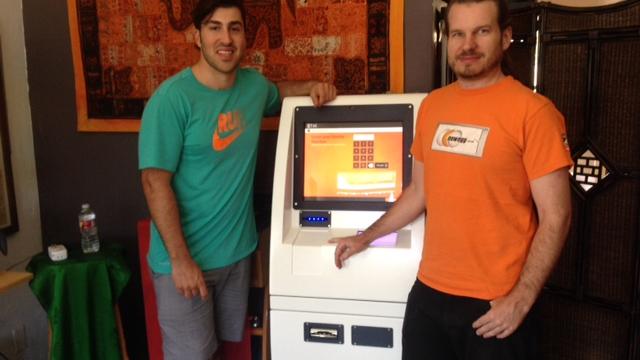 Chris McAlary, left, the CEO of Coin Cloud with David Edwards, the president of New Mexico Tea Co., and New Mexico's first bi-directional Bitcoin ATM machine. The new machine will dispense cash, or Bitcoin, in New Mexico Tea Co.