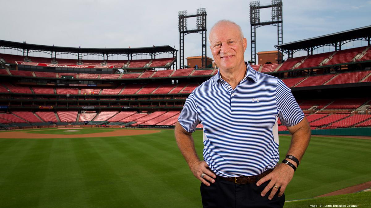 St. Louis Cardinals clubhouse attendent Mark Walsh places boxes on