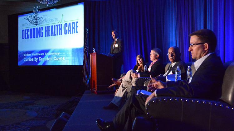 Panelists gather for the Decoding Healthcare breakfast panel at DoubleTree Orlando Downtown.