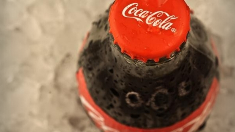 The Coca-Cola Co. is promoting smaller sizes of its cola beverages to consumers.