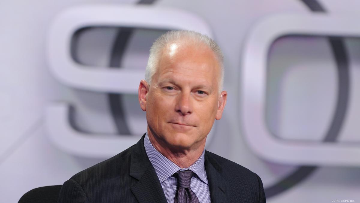 Kenny Mayne of ESPN walks off the field after he hit himself in