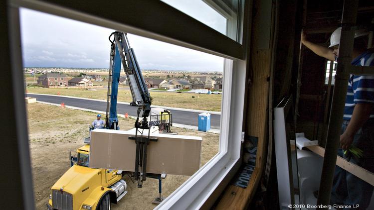 A new single-family home is under construction in Thornton, Colorado. Dallas-Fort Worth has been a hot real estate market, in part, because of its affordability, which is being threatened as home prices escalate. Photographer: Matthew Staver/Bloomberg