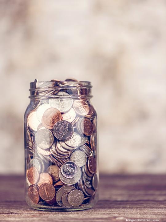 Donation jar overflowing with money