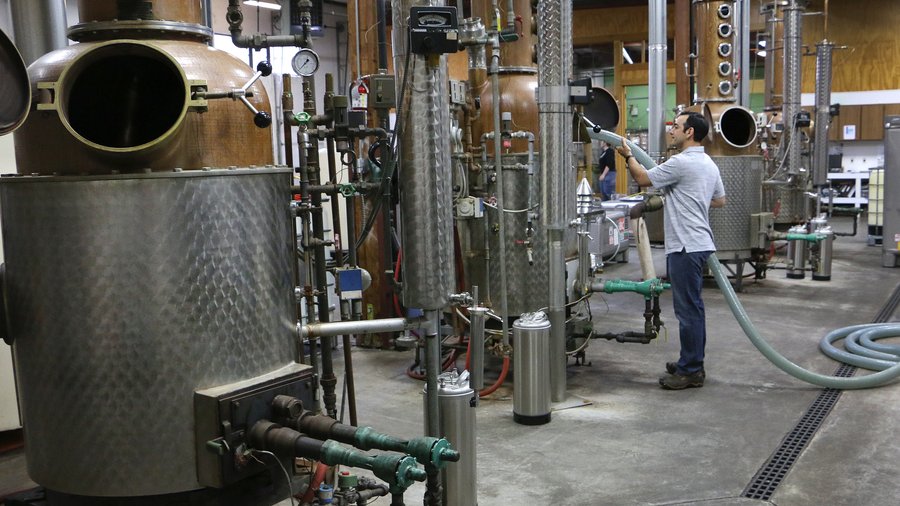 Clear Creek Distillery Daniel Ruiz head distiller cleans tanks (USE ...