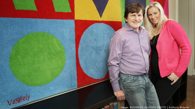 Charles Simonyi and his wife Lisa Simonyi stand in front of tapestry art by artist Victor Vasarely in their Puget Sound area home on Jan. 17, 2013. [the Simonyi family requests that their home address/neighborhood be confidential]