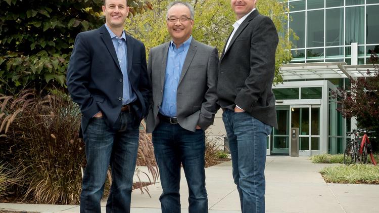 Steve Hirai, Senior Director of Corporate Services at Cloudera is flanked by Newmark Cornish &amp; Carey brokers Ben Stern, left, and Jon Cannon, right.