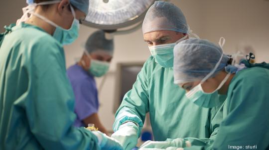 male and female surgeon during an operation