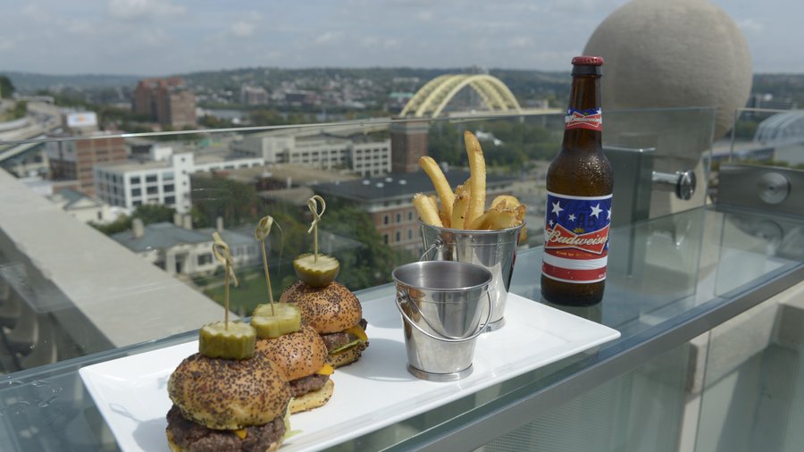 Sliders, fries and a Budweiser perch on the glass bar at Top of the ...