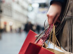 Closeup of woman holding shopping bags