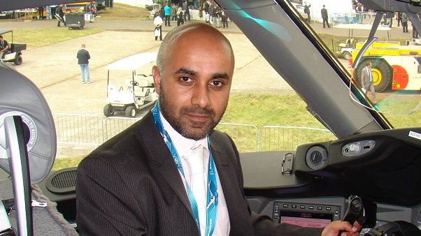Saj Ahmad siting in a Boeing Dreamliner  787 8