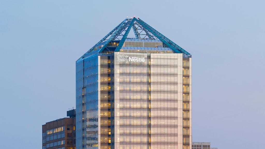 Nestle still plans to shift its . headquarters from Glendale, Calif., to  Monday Properties' 1812 N. Moore St. in Rosslyn, Arlington County, Va.,  even with plans to shed its . confectionery business