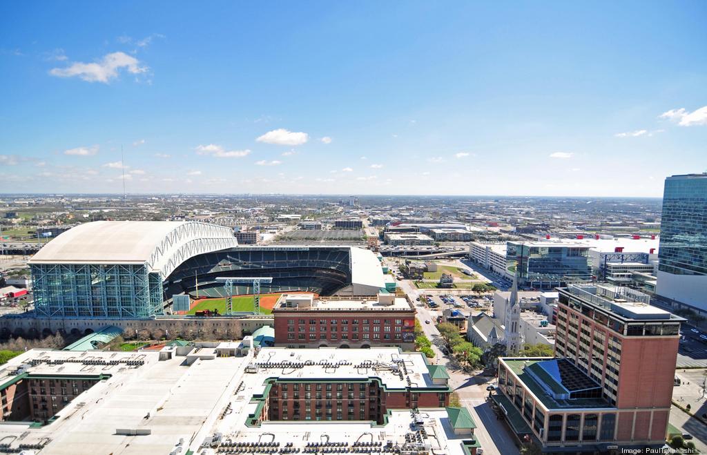 Aerial night view of Minute Maid Park with the roof opened in downtown  Houston