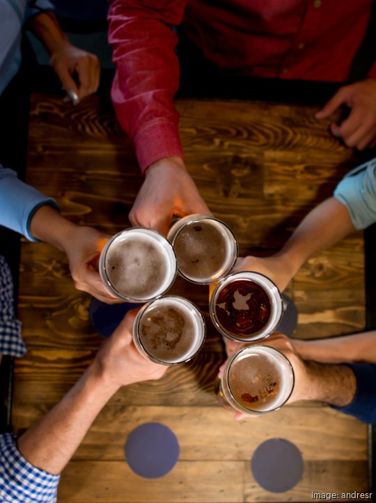 Group of friends having drinks at the bar