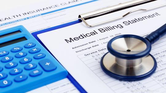 Medical bill and insurance form with calculator