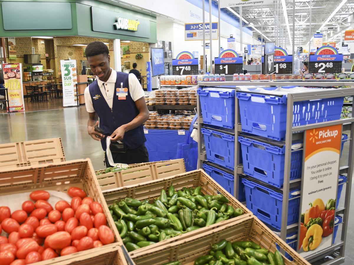 Walmart staff welcomes customers to remodeled Richardson location