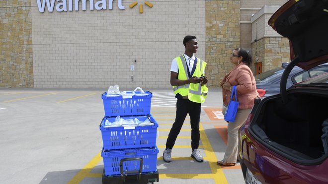 Walmart staff welcomes customers to remodeled Richardson location