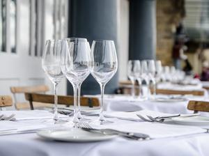 Empty table seen from side on terrace of restaurant