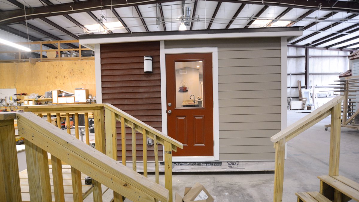 Couple Lives in $90,000 Tiny Home on Wheels With Office, Bedroom, More