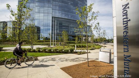 Northwestern Mutual Gardens Sign bicycle rider