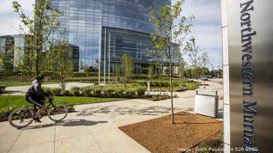 Northwestern Mutual Gardens Sign bicycle rider