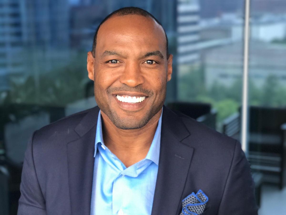 Real estate firm drafts new player with Darren Woodson Dallas
