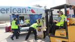 American Airlines ramp workers are seen here loading up supplies to be flow to Puerto Rico.