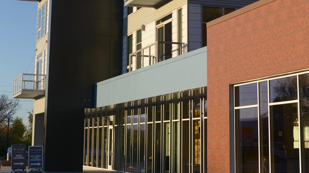 New Hopkins luxury apartment building has restored tractors, rooftop