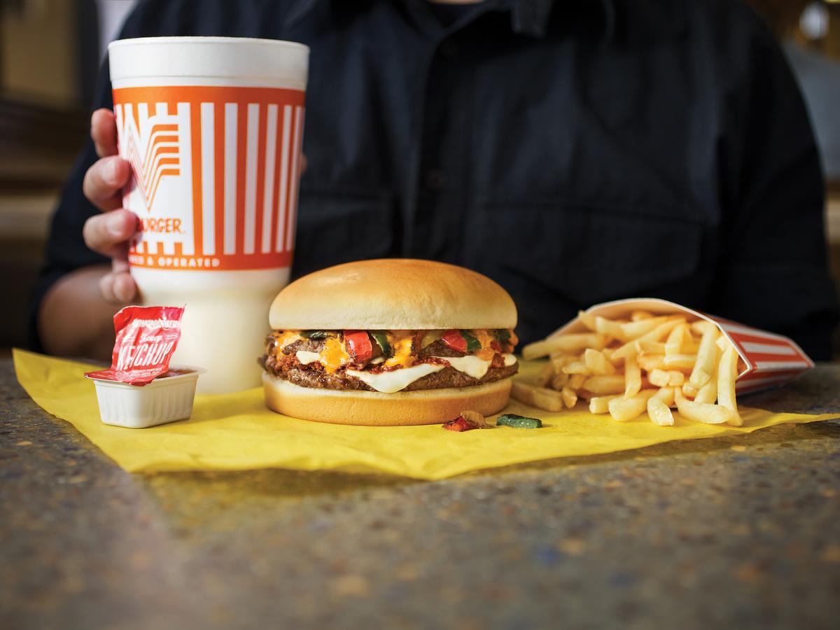 How much has the price of a burger at Whataburger changed since