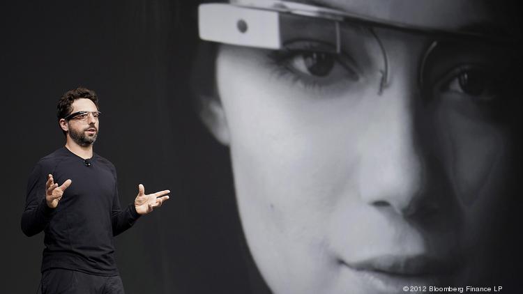 Alphabet President and Google co-founder Sergey Brin wears its Google Glass wearable Internet glasses while speaking at the Google I/O conference in San Francisco in June 2012. The company later scrapped a consumer version of the product.