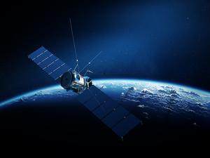 Communications satellite orbiting earth