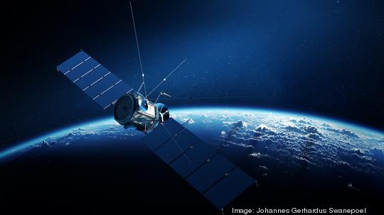 Communications satellite orbiting earth