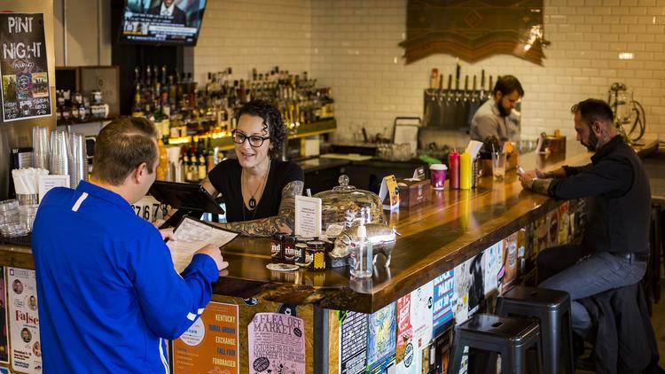Local Louisville Restaurants Largely Thriving At A Time When Some Grind Burger Kitchen Server Mia Fonlupt Second From Left Serves A Customer At The